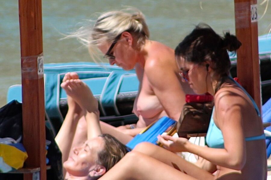 Free porn pics of Blonde mature caught topless in Psarou beach, Mykonos!! 5 of 9 pics
