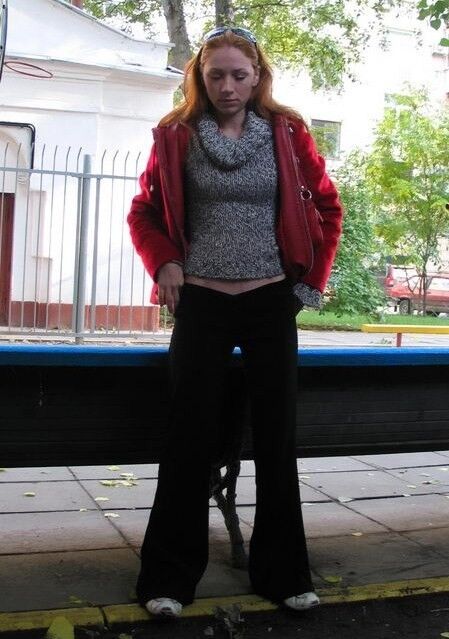 Free porn pics of Young mature redhead pulls down trousers and pisses on the stree 9 of 15 pics
