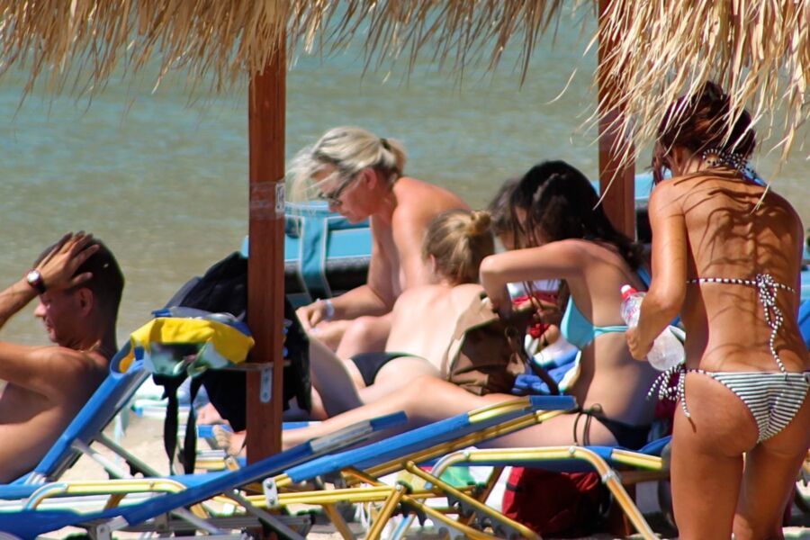 Free porn pics of Blonde mature caught topless in Psarou beach, Mykonos!! 3 of 9 pics