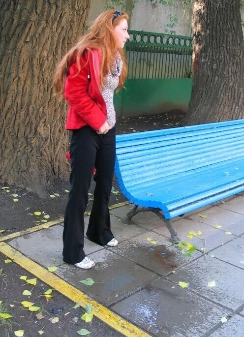 Free porn pics of Young mature redhead pulls down trousers and pisses on the stree 2 of 15 pics