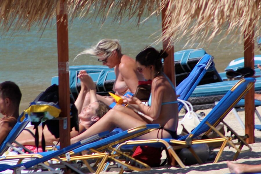 Free porn pics of Blonde mature caught topless in Psarou beach, Mykonos!! 7 of 9 pics