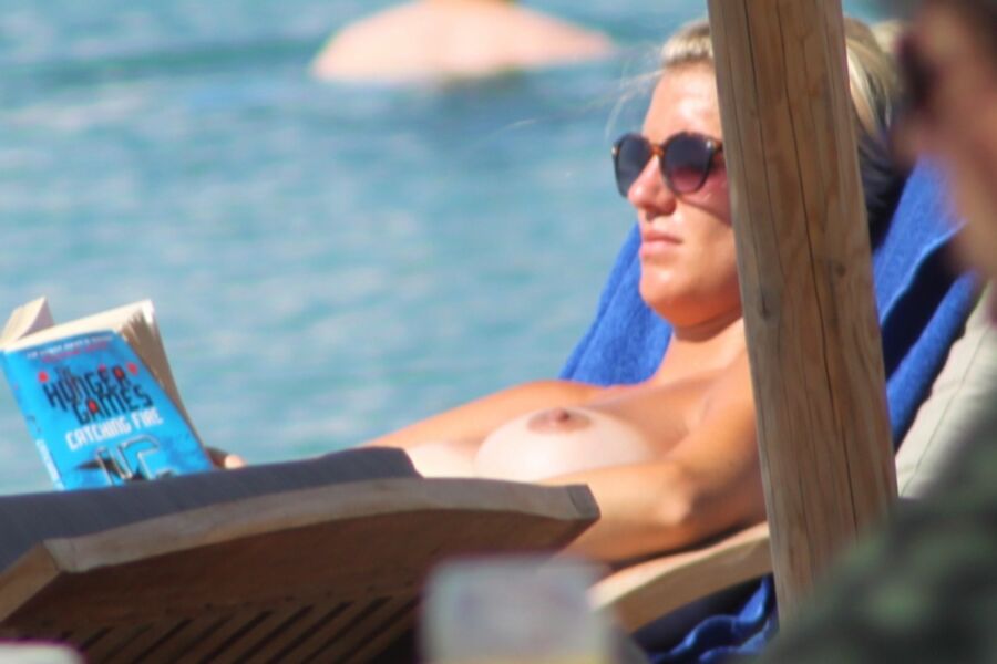 Free porn pics of Blonde babe caught topless in Ornos beach, Mykonos! 4 of 11 pics